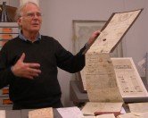 Michael Twyman showing a very old passport Michael Twyman showing a very old passport