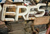 Retired sign letters in a new context